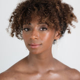 Styled pearl earrings on bride