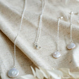 Silver necklace and silver pearl drop earrings